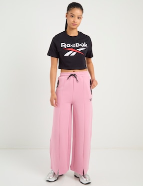 Pants acampanado Reebok con agujeta para mujer